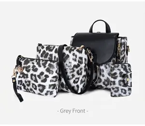 Front view of grey leopard print four-piece handbag set including backpack and crossbody bag