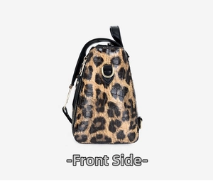 Detail view of leopard print PU leather bag showing gold D-ring and side zipper texture