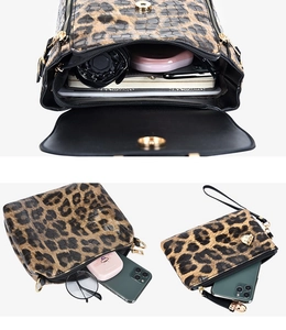 Detailed view of leopard print handbag set showing spacious interior and alligator texture