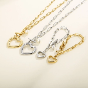 Parure collier et bracelet maille trombone en or et argent avec pendentif cœur et perle