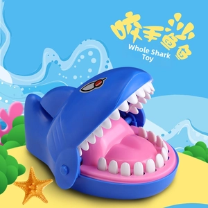 Blue shark biting finger toy with open mouth and teeth for interactive tabletop games