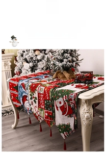 Macro view of Christmas table runner details with festive jacquard patterns and red tassels