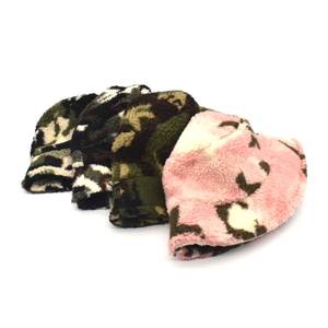 Close-up of camouflage lamb wool bucket hats showing soft textured fleece fabric