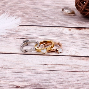 Three-piece heart-shaped shell inlay steel rings in silver, gold, and rose gold colors