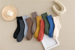 Close-up of ten colorful ribbed cotton socks arranged in a decorative fan display