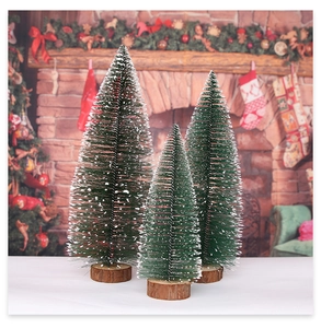 Three-piece set of mini snowy cedar Christmas trees with natural wood bases for table decor