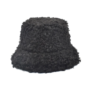 Detail shot of the plush black lamb wool texture on this thick winter bucket hat for women
