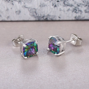Macro shot of silver square mystic topaz earrings with classic four-prong setting details