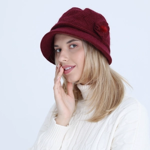 Close-up of wine red knitted bucket hat featuring elegant 3D floral decoration and texture