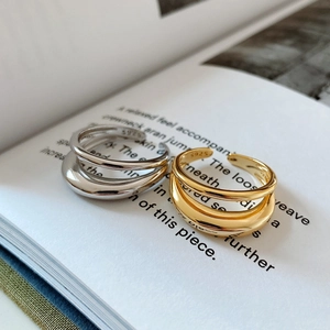 Detail of S925 sterling silver double-layer interlaced ring with engraved hallmark