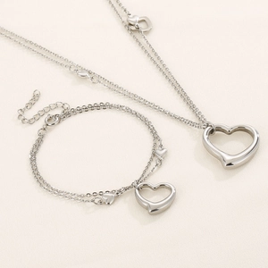 Double-layered silver heart pendant necklace and bracelet set in stainless steel