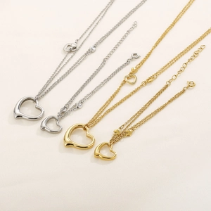 Set of heart pendant necklaces in gold and silver finish with double-layered chains