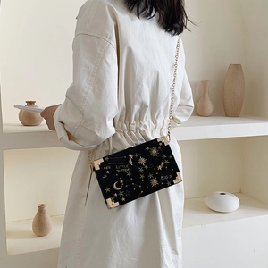 Chic black crossbody box bag with gold star embroidery and metal chain strap for women
