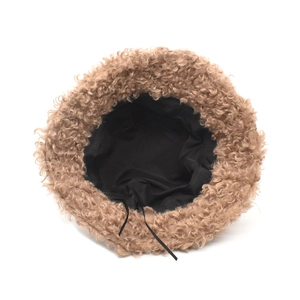 Detail view of winter faux lamb wool bucket hat showing soft lining and adjustment drawstring