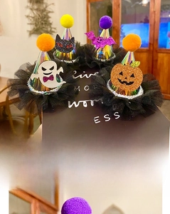 Detail of Halloween hair clips featuring pumpkin, bat and ghost motifs with sequins