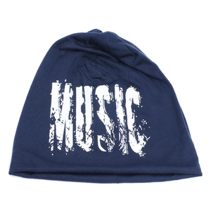 Detail of navy knit beanie showing textured fabric and MUSIC letter print on white background
