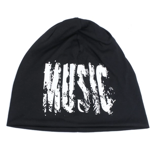 Detail of music letter print on a black knitted beanie hat with a street style aesthetic