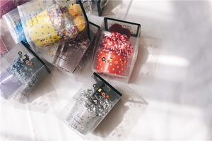 Cozy coral fleece cake socks in colorful patterns inside premium transparent gift boxes