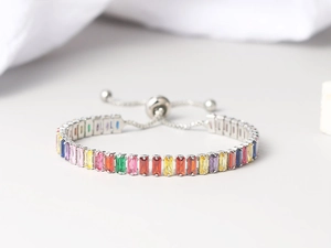 Close-up of adjustable tennis bracelet featuring colorful rectangular zircon stones