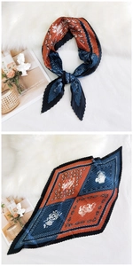 Detailed pleats on diamond silk scarf with orange and navy paisley contrast