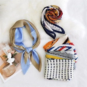 Collection of pleated paisley square neck scarves in various patterns and colors