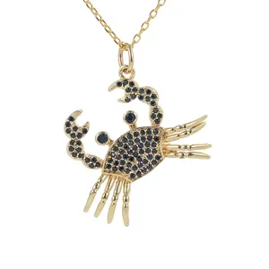 Golden crab pendant necklace for women featuring sparkling black micro-pave crystals