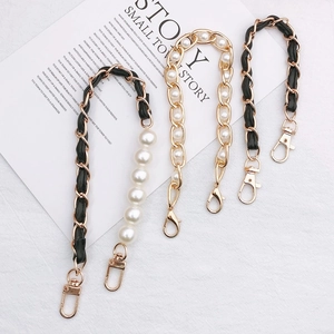 Detailed view of DIY pearl and leather strap chains for handbags and phone cases