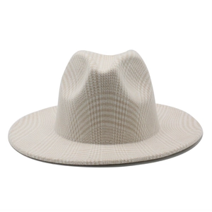 Detailed close-up of a stiff beige plaid wool fedora hat with a classic flat brim