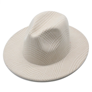 Detail shot of the beige plaid pattern and texture on a classic wide brim wool fedora hat