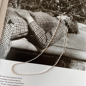 Detail of 925 sterling silver olive bead necklace with dual chain asymmetric design