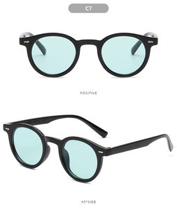 Detail of vintage round sunglasses in C7 color with silver rivets and light blue lenses