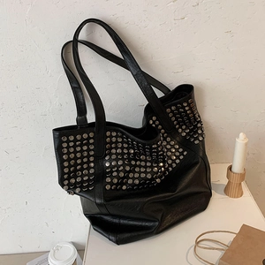 Fashionable black leather tote bag with silver studs and a spacious large capacity design