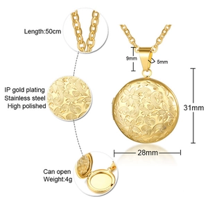 Detail showing an openable round locket pendant with vintage patterns in golden finish