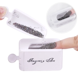Detail showing the portable nail art dipping powder container with colorful beads
