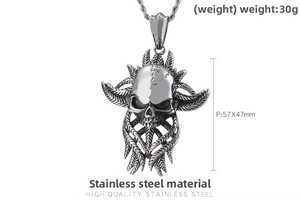 Detail of gothic skull pendant in stainless steel with feather textures and 30g weight