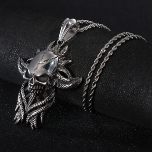 Detailed view of silver skull pendant with feather accents and durable rope chain