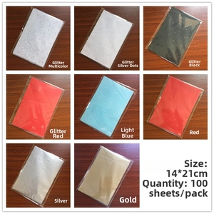 Macro detail of A5 colorful tissue paper set with glitter and solid finishes for DIY crafts