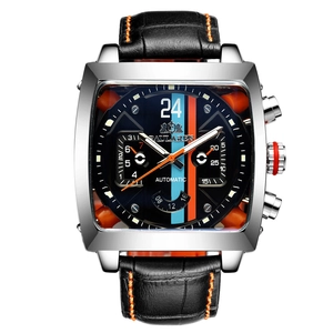 Detail of square automatic watch dial with racing stripes and orange leather stitching