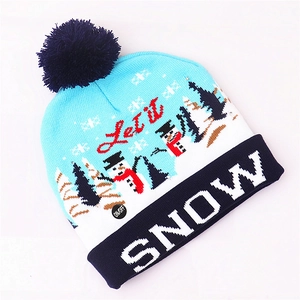 Detail of knitted Christmas hat with LED ON/OFF switch and Let it SNOW pattern