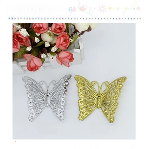 Detailed view of hollow decorative gold and silver plastic butterflies for Christmas decor