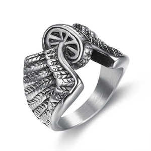 Retro stainless steel biker ring featuring motorcycle wheel and wing motifs on white background