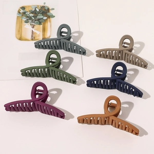 Detailed arrangement of large matte hair claws in six various Morandi colors