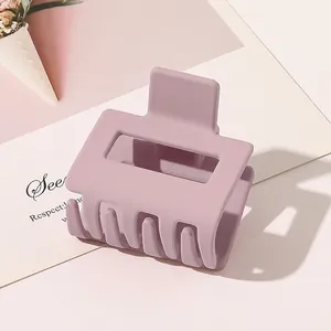 Macro detail of lavender matte square hollow hair claw clip showing textured finish
