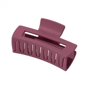 Detail view of large rectangular matte purple hair claw clip with hollow design