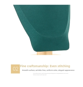 Macro detail of dark green velvet necklace display stand with premium wooden base