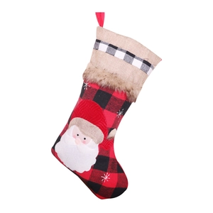Red and black buffalo plaid Christmas stocking featuring 3D Santa Claus and faux fur trim