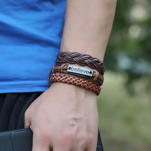 Multilayer braided leather bracelet set with metallic believe plate on wrist