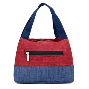 Portable red and blue canvas lunch bag with dual color stitching and black zipper pocket