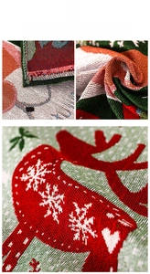 Detail of Christmas table runner with jacquard woven reindeer and snowflake patterns