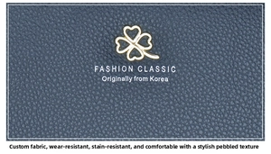 Detail of blue lychee texture leather with gold clover logo and wear-resistant finish
